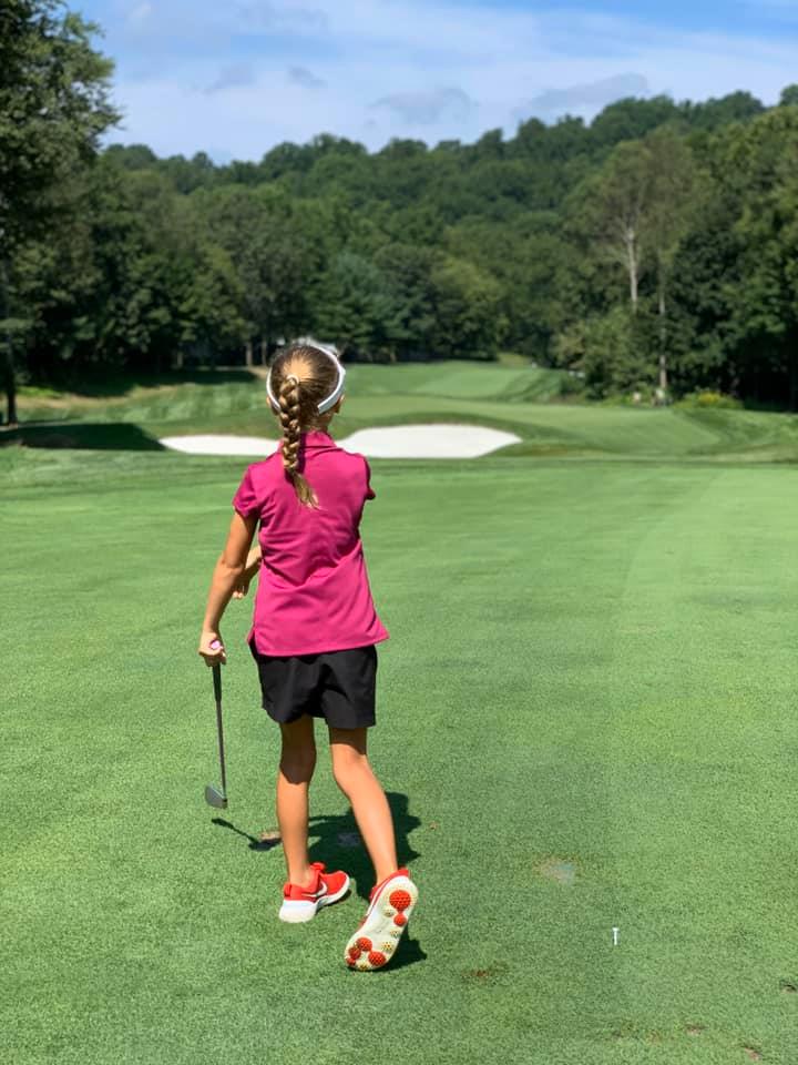 A young girl on the fairway at Hollow Brook's private golf club course in Cortlandt Manor, NY