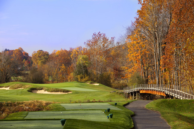 A view of Hole 17 with a wooden bridge on the golf course at Hollow Brook Golf Club in Cortlandt Man
