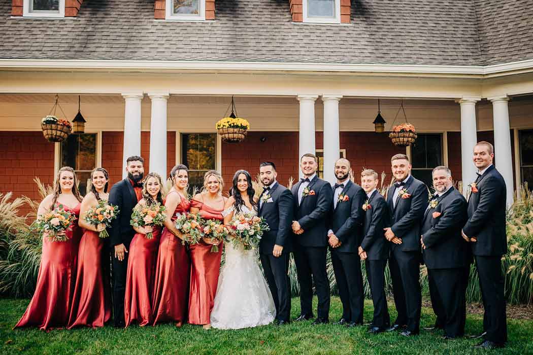 A newly-wed couple sharing a sweet moment with the bridesmaids and groomsmen in Cortlandt Manor, NY