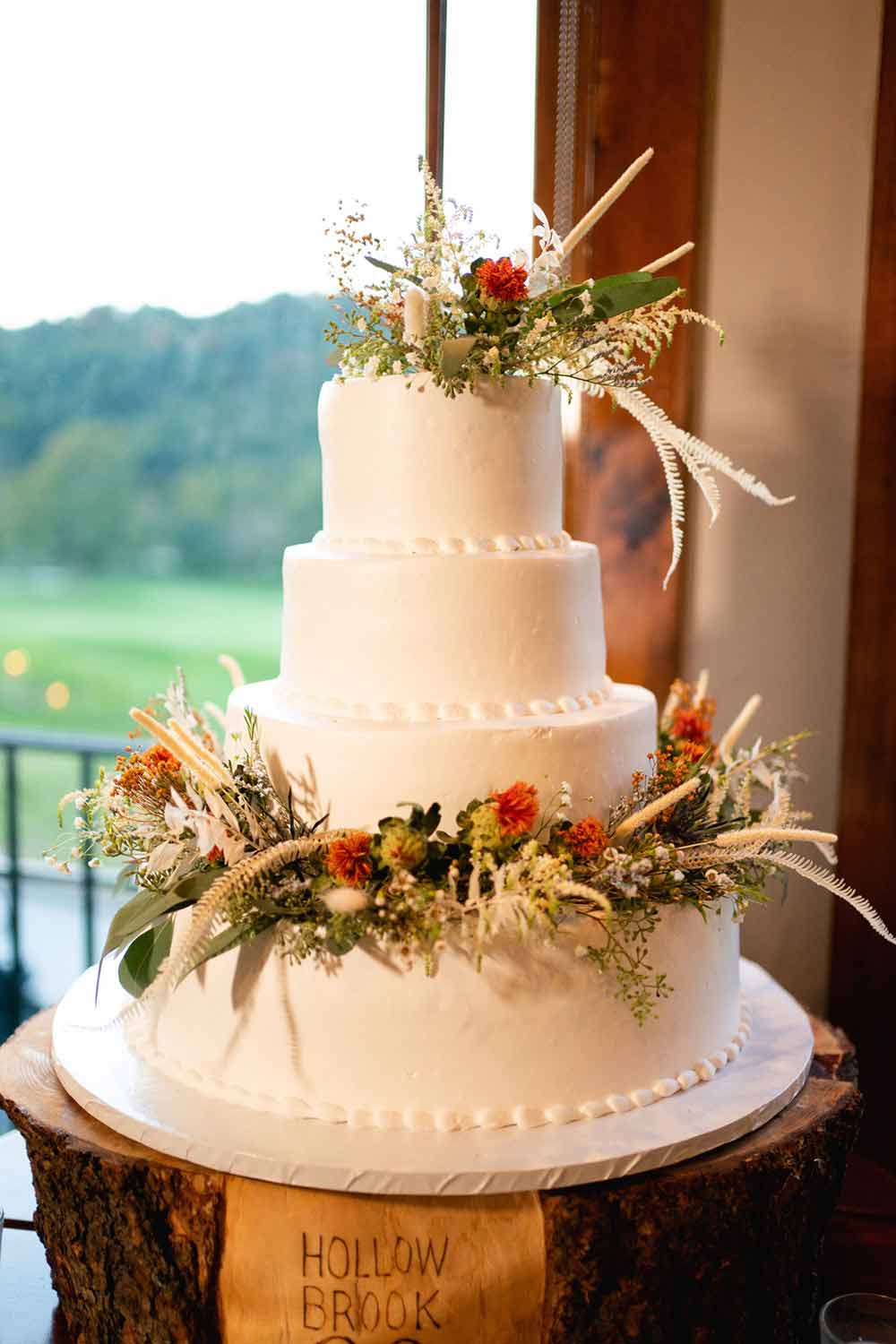 A beautifully decorated wedding cake for a married couple at Hollow Brook Golf Club
