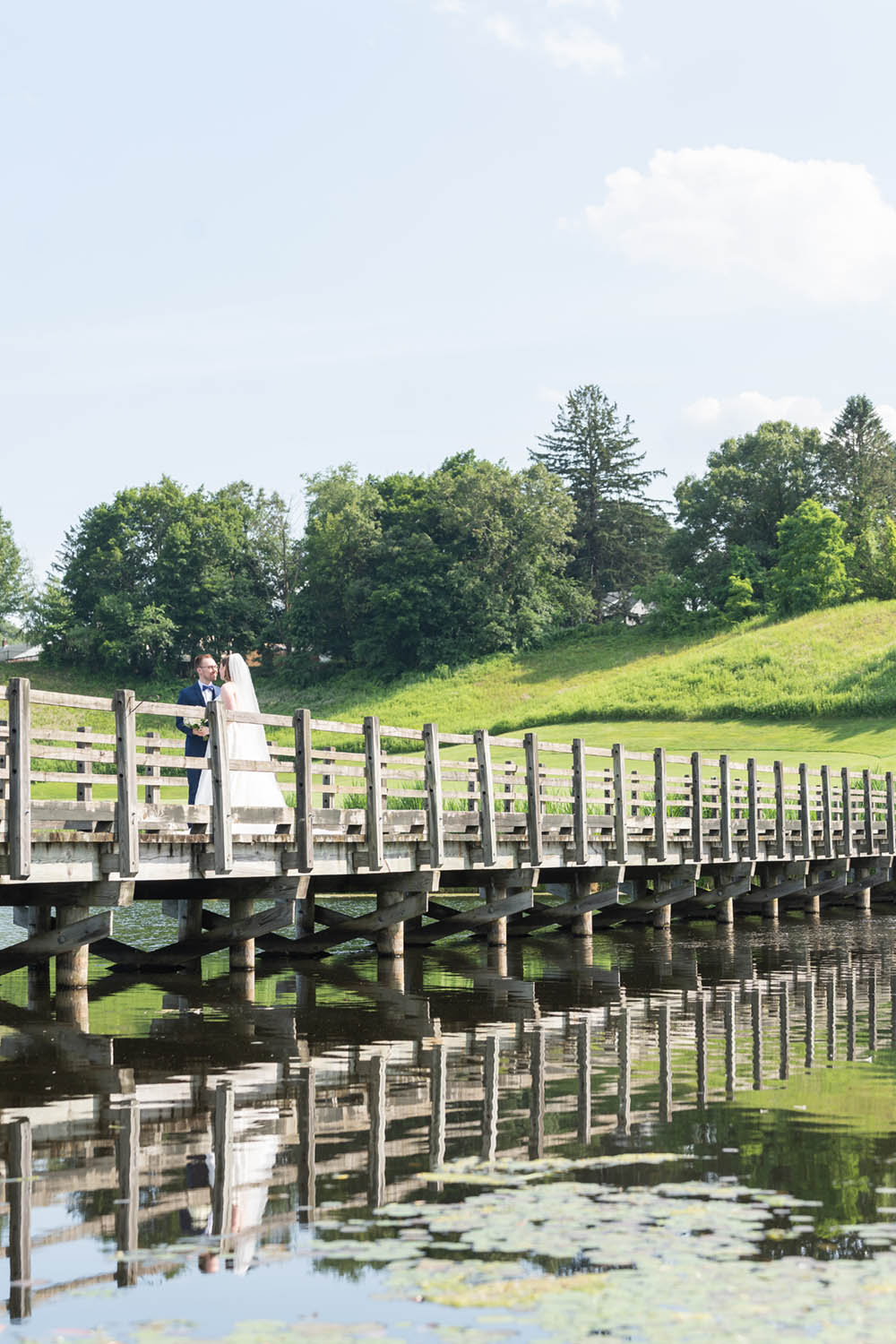 Bride and Groom on Bridge at Hollow Brook